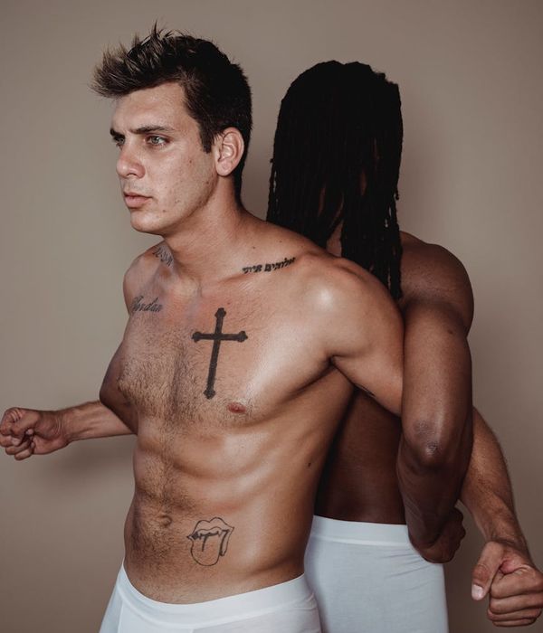 Man performing a controlled strength exercise in a minimalist environment.